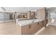 Spacious kitchen featuring marble countertops, custom wood cabinetry, stainless steel appliances, and recessed lighting at 7157 E Rancho Vista Dr # 3001, Scottsdale, AZ 85251