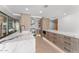 Bright kitchen boasts marble countertops, stainless steel appliances, custom wood cabinets, and recessed lighting at 7157 E Rancho Vista Dr # 3001, Scottsdale, AZ 85251