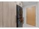 Convenient laundry area with stacked washer and dryer along with custom cabinetry for storage solutions at 7157 E Rancho Vista Dr # 3001, Scottsdale, AZ 85251