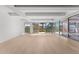 Bright living room featuring expansive windows and sleek wood flooring at 7157 E Rancho Vista Dr # 3001, Scottsdale, AZ 85251