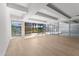 Bright living room featuring expansive windows and sleek wood flooring at 7157 E Rancho Vista Dr # 3001, Scottsdale, AZ 85251