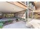 Expansive ground level patio with natural stone and privacy screens at 7157 E Rancho Vista Dr # 3001, Scottsdale, AZ 85251
