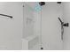 Modern shower boasts a glass enclosure, rain shower head, and sleek bench for a spa-like experience at 7157 E Rancho Vista Dr # 3001, Scottsdale, AZ 85251