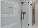 Modern shower with glass door, sleek black fixtures, and marble-tiled walls exudes minimalist luxury at 7157 E Rancho Vista Dr # 3001, Scottsdale, AZ 85251