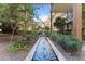 Outdoor fountain in landscaped courtyard between modern buildings at 7157 E Rancho Vista Dr # 3001, Scottsdale, AZ 85251
