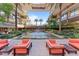 Relaxing patio area with comfortable seating next to a peaceful water feature in a lush courtyard setting at 7157 E Rancho Vista Dr # 3001, Scottsdale, AZ 85251