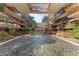 Zen courtyard featuring a tranquil water feature surrounded by meticulously maintained grounds and palm trees at 7157 E Rancho Vista Dr # 3001, Scottsdale, AZ 85251
