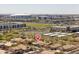 A view of the neighborhood with a stadium and cityscape in the background at 7214 N 88Th Ln, Glendale, AZ 85305