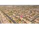 Picture of a sprawling neighborhood with neat rows of houses and green spaces at 7214 N 88Th Ln, Glendale, AZ 85305