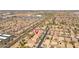 Expansive aerial view of a neighborhood with well-maintained homes and lush landscaping at 7214 N 88Th Ln, Glendale, AZ 85305
