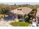 Lovely home featuring a three-car garage, well manicured lawn, mature trees, and a tile roof at 7214 N 88Th Ln, Glendale, AZ 85305