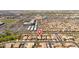 An elevated view of the neighborhood showcasing lush green spaces and the home's location at 7214 N 88Th Ln, Glendale, AZ 85305