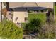 A backyard view of a grassy lawn, patio furniture, and desert landscaping at 7214 N 88Th Ln, Glendale, AZ 85305