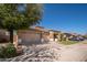 Charming single story home featuring a three-car garage, low maintenance landscaping, and a tile roof at 7214 N 88Th Ln, Glendale, AZ 85305