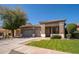 Charming single story home featuring a three-car garage, low maintenance landscaping, and a tile roof at 7214 N 88Th Ln, Glendale, AZ 85305