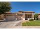 Charming single story home featuring a three-car garage, low maintenance landscaping, and a tile roof at 7214 N 88Th Ln, Glendale, AZ 85305