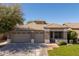 Charming single story home featuring a three-car garage, low maintenance landscaping, and a tile roof at 7214 N 88Th Ln, Glendale, AZ 85305