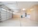 Spacious garage featuring abundant cabinet space and ample room for vehicles at 7214 N 88Th Ln, Glendale, AZ 85305