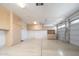 Spacious garage features built-in storage cabinets and access to the home and garage door at 7214 N 88Th Ln, Glendale, AZ 85305