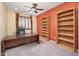 Spacious office with built-in bookshelves, desk, and large window at 7214 N 88Th Ln, Glendale, AZ 85305