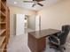 Comfortable carpeted office with natural light, desk and built in bookcase, perfect for a home office at 7214 N 88Th Ln, Glendale, AZ 85305