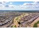 Bird's eye view of desert home community with beautiful green landscaping and golf course at 7380 E Canyon Wren Dr, Gold Canyon, AZ 85118