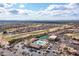 Overhead community view of desert homes, lush green golf course and resort-style amenities at 7380 E Canyon Wren Dr, Gold Canyon, AZ 85118