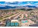Spectacular aerial view of community featuring pool, tennis courts and mountain views at 7380 E Canyon Wren Dr, Gold Canyon, AZ 85118