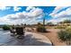 Beautiful backyard featuring a stone patio and seating, perfect for enjoying the desert landscape at 7380 E Canyon Wren Dr, Gold Canyon, AZ 85118