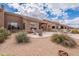 The home features a desert landscape and patio at 7380 E Canyon Wren Dr, Gold Canyon, AZ 85118