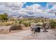 Inviting backyard with seating areas and mountain views, perfect for outdoor enjoyment at 7380 E Canyon Wren Dr, Gold Canyon, AZ 85118