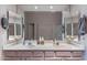 Bathroom featuring double sinks with neutral countertops and large mirrors at 7380 E Canyon Wren Dr, Gold Canyon, AZ 85118