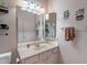 Cozy bathroom featuring a vanity with a large mirror and playful cactus decor at 7380 E Canyon Wren Dr, Gold Canyon, AZ 85118
