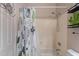 Bathroom featuring tub with playful cactus shower curtain at 7380 E Canyon Wren Dr, Gold Canyon, AZ 85118