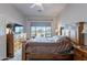 Bedroom featuring a wooden bed frame, and a large window offering abundant natural light at 7380 E Canyon Wren Dr, Gold Canyon, AZ 85118