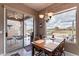 Comfortable dining area with a view of the outdoor patio and expansive backyard landscaping at 7380 E Canyon Wren Dr, Gold Canyon, AZ 85118