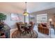 Comfortable dining room area with stylish furniture and decor, perfect for Gathering meals and entertaining at 7380 E Canyon Wren Dr, Gold Canyon, AZ 85118