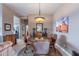 Formal dining room with decorative chandelier and elegant furnishings at 7380 E Canyon Wren Dr, Gold Canyon, AZ 85118