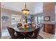 Dining room with backyard view, and flows into the living room, creating an inviting gathering space at 7380 E Canyon Wren Dr, Gold Canyon, AZ 85118