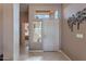Inviting foyer with tiled floors, natural light, and stylish decor, setting a welcoming tone for the home at 7380 E Canyon Wren Dr, Gold Canyon, AZ 85118