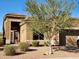 Well-maintained home with a desert landscape featuring a beautiful mesquite tree at 7380 E Canyon Wren Dr, Gold Canyon, AZ 85118