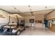 Spacious garage with storage cabinets and a golf cart at 7380 E Canyon Wren Dr, Gold Canyon, AZ 85118