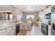 Bright kitchen with granite counters, white cabinets and stainless steel appliances and a scenic view at 7380 E Canyon Wren Dr, Gold Canyon, AZ 85118
