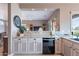 Bright kitchen featuring granite countertops, appliances, and an open layout with a view to the living room at 7380 E Canyon Wren Dr, Gold Canyon, AZ 85118