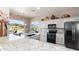 Well-appointed kitchen with granite countertops and stainless steel appliances, showcasing bright natural light at 7380 E Canyon Wren Dr, Gold Canyon, AZ 85118