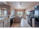 Contemporary kitchen with granite countertops and appliances, conveniently located near the dining area at 7380 E Canyon Wren Dr, Gold Canyon, AZ 85118