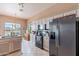 Stylish kitchen equipped with appliances, granite counters, and views to the landscaped outdoor space at 7380 E Canyon Wren Dr, Gold Canyon, AZ 85118