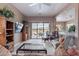 Inviting living room with neutral tones, ceiling fan and sliding door access to backyard views at 7380 E Canyon Wren Dr, Gold Canyon, AZ 85118