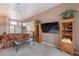 Comfortable living room with ceiling fan, carpet, tv, and a view of the front yard at 7380 E Canyon Wren Dr, Gold Canyon, AZ 85118