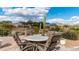 Outdoor patio featuring a dining table with mountain views, perfect for entertaining or enjoying the desert scenery at 7380 E Canyon Wren Dr, Gold Canyon, AZ 85118